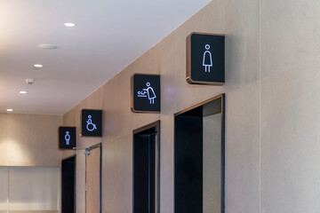 Icons with the designation of toilets in a public place. Side view.