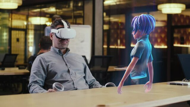 A man with virtual reality glasses uses a joystick to connect the video chat with an avatar of a girl via hologram in the metaverse. Augmented reality concept.