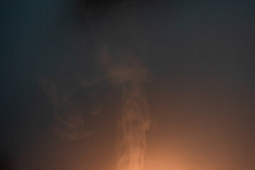 Abstract smoke / steam in glow of lamp