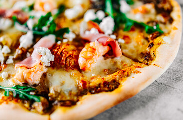 Pizza with Mozzarella cheese, meat, beef, ham, mushroom, shrimp, spices. Italian pizza