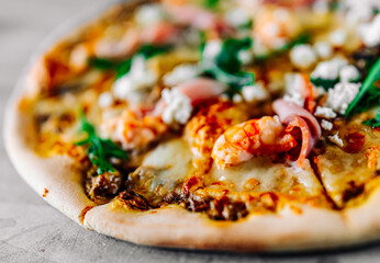 Pizza with Mozzarella cheese, meat, beef, ham, mushroom, shrimp, spices. Italian pizza