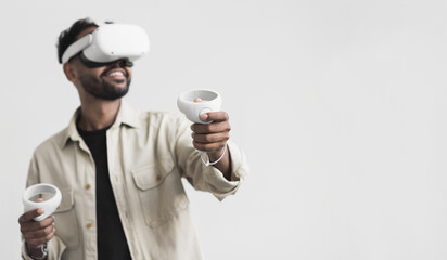 Young man using virtual reality headset at home, VR, future gadgets, technology, virtual event,...