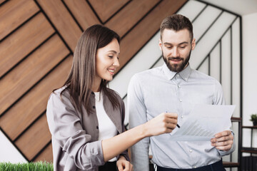 Young people professionals working in office, Colleagues in coworking discussing project, coworkers working together in boardroom, brainstorming, discussing and analyzing business strategy.