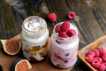 Milk yogurt with raspberries, close up