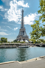 Fototapeta na wymiar The famous Eiffel Tower in Paris with a dramatic sky