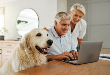 Happy senior couple, laptop and dog at table together in living room. Elderly man and woman...
