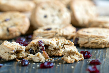delicious dried cookies made of high-quality flour with dried red cranberries on the table