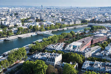Panoramic view from second floor of Eiffel tower in Paris. View of the buildings, parks with Debilly foot bridge over river Siene