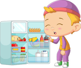 The little boy is very hungry and he opens the refrigerator to take food