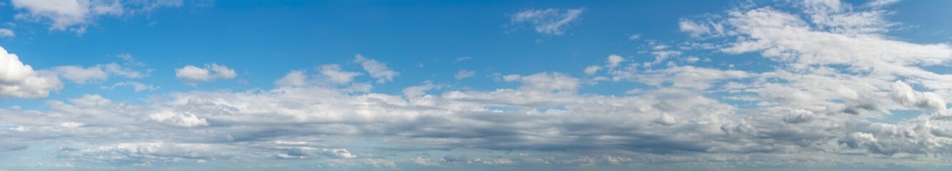 Fantastic clouds against blue sky, panorama