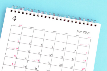 calendar april 2023 top view on a blue background