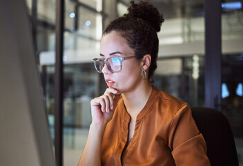 Night work, planning and business woman reading an email about web design in a dark office....