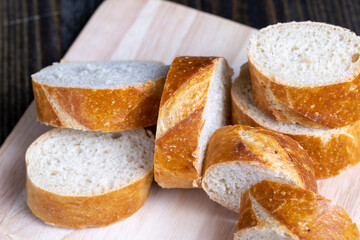 sliced into pieces a long baguette with a crispy crust