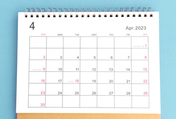 calendar april 2023 top view on a blue background - obrazy, fototapety, plakaty