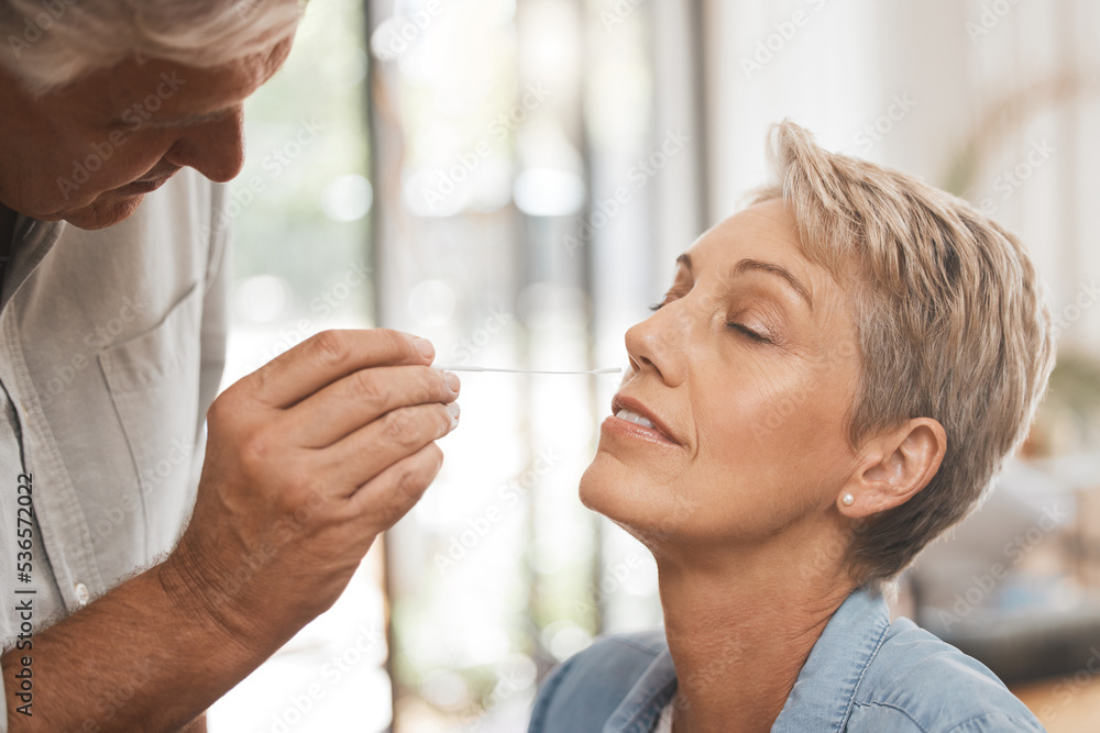 Poster Covid, healthcare and test with a woman and man doing a nasal swab in the home for pcr testing. Medical, care and insurance with a senior couple in a house during the corona virus pandemic