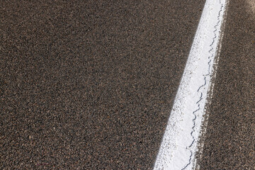 Paved highway with white road markings