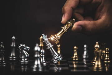 Hand choose king chess fight concept of challenge or team player or business team and leadership...