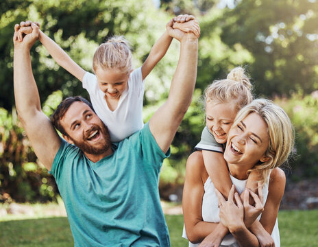 Love, happy and family playing in a park, laugh and relax while having fun together. Freedom, kids and caring parents embracing and enjoying quality time with fun game outdoors, cheerful and positive