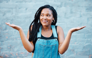 Model, smile and hands for gesture of confusion pose in street against blue wall. Black woman,...