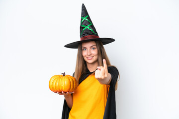 Young caucasian woman costume as witch holding a pumpkin isolated on white background doing coming gesture