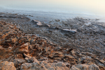 details of  dead sea coastline covered of salt crystals