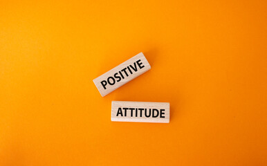 Positive attitude symbol. Concept words Positive attitude on wooden blocks. Beautiful orange background. Business and Positive attitude concept. Copy space.