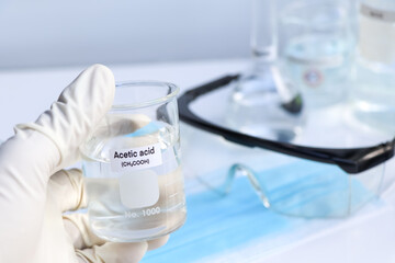 Fototapeta premium acetic acid in glass, chemical in the laboratory and industry