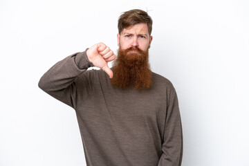 Obraz premium Redhead man with beard isolated on white background showing thumb down with negative expression