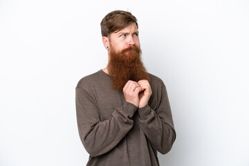 Redhead man with beard isolated on white background scheming something