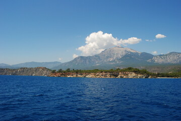 Turkey Mediterranean sea some mountains with the trees and blue sea water white clouds