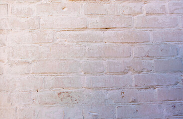 Texture of an old brick wall. The wall is painted with chalk.