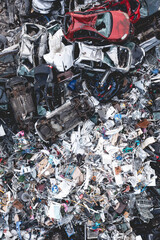 Aerial view directly above a pile of scrap metal and crushed vehicles