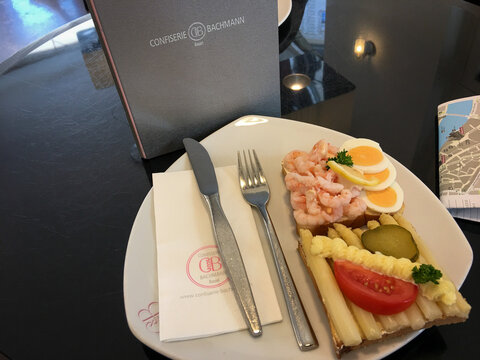 Basel, Schweiz - July 17, 2017: Delicious sandwches on a plate at Confiserie Bachmann