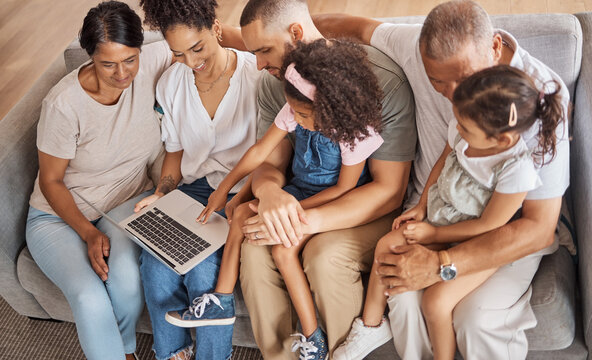 Top View, Laptop And Family Watch Cartoon Movies Or Streaming Online In The Living Room On A Sofa. Diverse Senior People, With Parents And Grandchildren On Couch In Family Home Enjoy Slideshow.