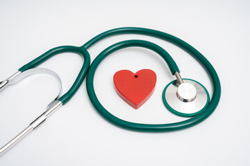 medical stethoscope and red heart on a blue background