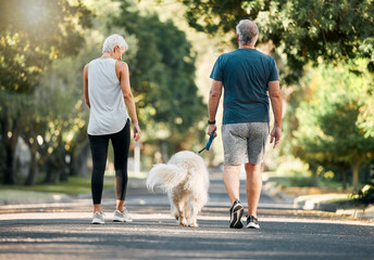 Senior couple, dog walk and nature park road during exercise, walking and leisure during a stroll through the woods. Old man and woman being active for energy and living healthy with a pet outside - Powered by Adobe
