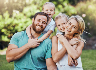 Family portrait, parents and children bonding in hug in house garden, nature park or environment in...