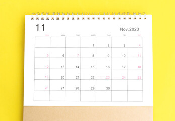 calendar november 2023 top view new year concept on a yellow background