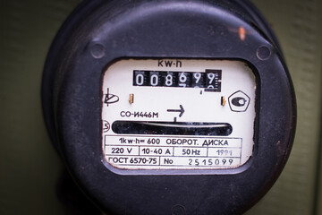 Close-up of old soviet retro electric meter. Energy crisis and power outage. High price of...