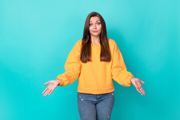 Fototapeta na wymiar Portrait photo of young attractive funny indifferent woman wear yellow shirt palms no idea funny grimace sorrry puzzled isolated on cyan color background