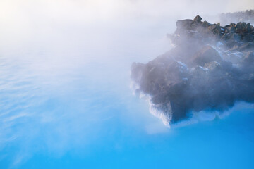 Blue Lagoon, Iceland. Natural background. Geothermal spa for rest and relaxation in Iceland. Warm springs of natural origin. Blue lake and steam.