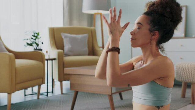 Meditation, pilates and home yoga for black woman working on spiritual chakra peace, freedom of the mind and zen mindset. Body health, wellness lifestyle and relax girl training on living room floor