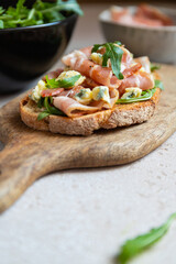Toast with bacon, fresh arugula and blue cheese. 