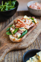 Toast with bacon, fresh arugula and blue cheese. 