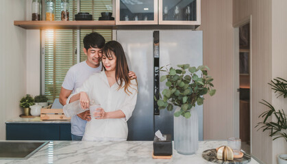 happy asian couple cooking healthy food. smiling boyfriend and girlfriend making breakfast support each other. attractive wife and cheerful husband preparing delightful meal with fresh ingredients