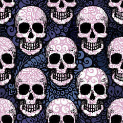 Seamless ethnic pattern with hand drawn skulls.