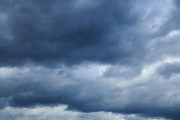 A large white cumulus cloud before the storm is approaching. Heavy cloudy. Clouds before thunderstorm. Summer sky with curly white clouds.