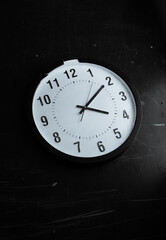 black and white photo of a clock