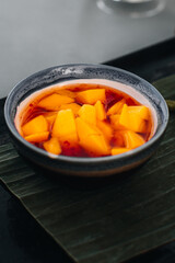 Thai spicy sauce with fresh mango pieces and chili