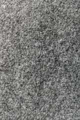 Gray felt textile material close-up background texture with copy space.